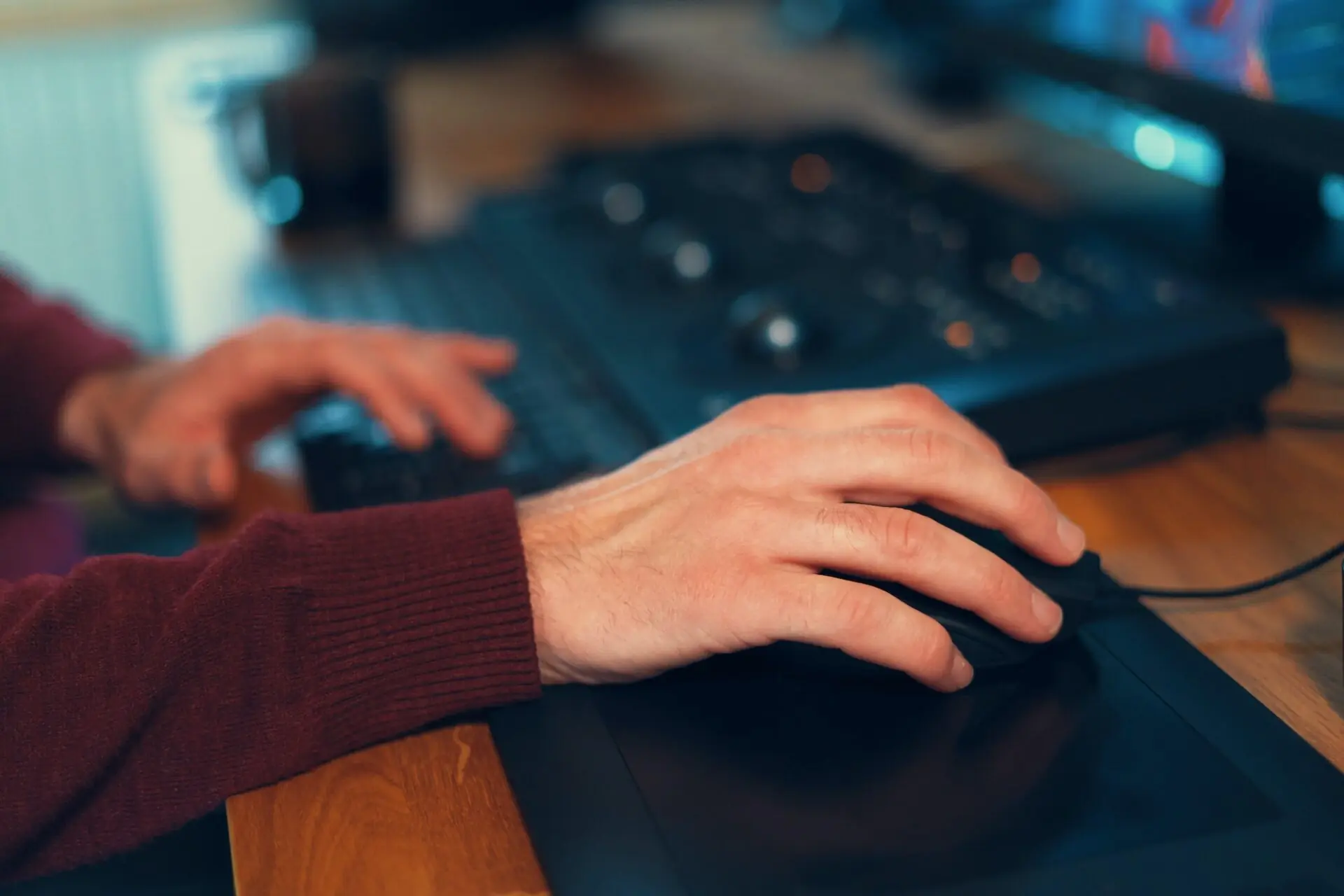 Video editor hands adjusting color or sound on working console machine